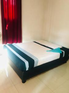 Postel nebo postele na pokoji v ubytování Hotel Deshapriya