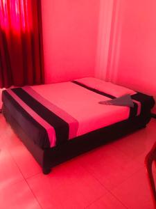 Postel nebo postele na pokoji v ubytování Hotel Deshapriya