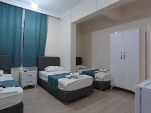 Postel nebo postele na pokoji v ubytování Odak Pansiyon + 23 fotografií