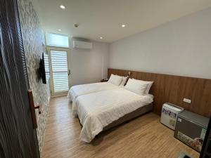 Krevet ili kreveti u jedinici u okviru objekta Yongshanshui B&B