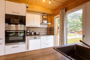 Kuchyňa alebo kuchynka v ubytovaní Kreischberg Chalets by ALPS RESORTS