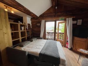 Postel nebo postele na pokoji v ubytování Chalet Le Ranch