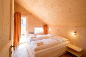 Posteľ alebo postele v izbe v ubytovaní Kreischberg Chalets by ALPS RESORTS
