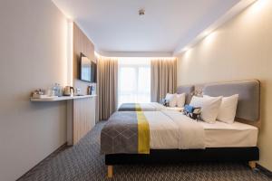 Posteľ alebo postele v izbe v ubytovaní Holiday Inn Express Warsaw - Mokotow by IHG