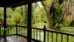 a view from the porch of a house at Deluxe bedroom at Rumah Sentosa in Kampong Sum Sum