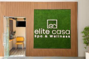 a door to a office with a green and white sign at Citadines Metro Central Dubai in Dubai