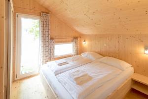 Posteľ alebo postele v izbe v ubytovaní Kreischberg Chalets by ALPS RESORTS