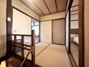 Ένα ή περισσότερα κρεβάτια σε δωμάτιο στο Tsumugu