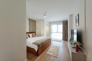 Postel nebo postele na pokoji v ubytování AWA Residence