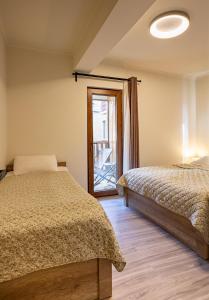 Postel nebo postele na pokoji v ubytování La Maison Mestia