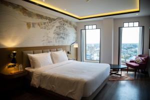 Rúm í herbergi á Sarovar Portico Birgunj