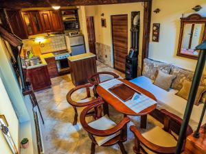 a kitchen with a table and chairs in a room at Prima Casa in Kotor
