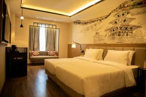 Rúm í herbergi á Sarovar Portico Birgunj