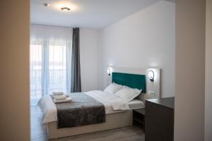 Postel nebo postele na pokoji v ubytování Casa Orhideea