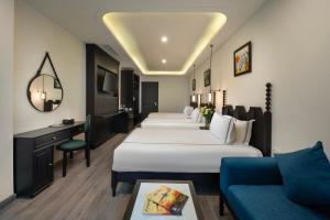 Postel nebo postele na pokoji v ubytování SQ Hang Gai hotel & Spa