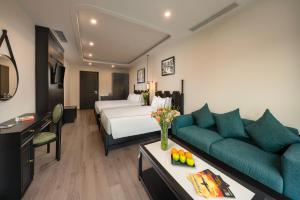 Postel nebo postele na pokoji v ubytování SQ Hang Gai hotel & Spa