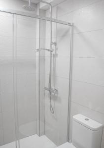 a shower stall in a bathroom with a toilet at MojacarProperty, Casa Isabel Playa in La Marina de la Torre