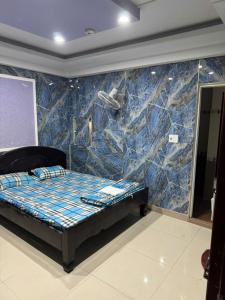 Postel nebo postele na pokoji v ubytování Quang Vinh Hotel + 3 fotografie