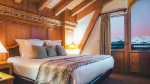 Postel nebo postele na pokoji v ubytování Hotel Carlina