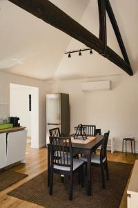 a kitchen and dining room with a table and chairs at Casa da Vira - Alojamento Local in Arcos de Valdevez
