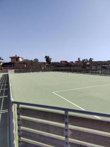 a tennis court with a tennis court at Casa La Ola Majanicho - Monthly Stays in Majanicho