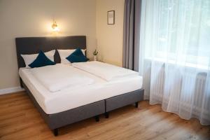 Postel nebo postele na pokoji v ubytování Hotel Altmünchen by Blattl
