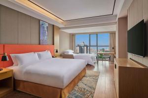 TV a/nebo společenská místnost v ubytování Hilton Garden Inn Wuhan Hankou