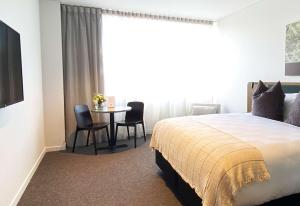 Sudima Queenstown Five Mile客房内的一张或多张床位