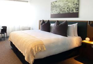 Sudima Queenstown Five Mile客房内的一张或多张床位