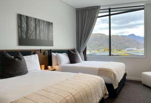 Postel nebo postele na pokoji v ubytování Sudima Queenstown Five Mile + 37 fotografií