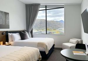 Sudima Queenstown Five Mile客房内的一张或多张床位