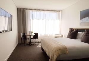 Sudima Queenstown Five Mile客房内的一张或多张床位