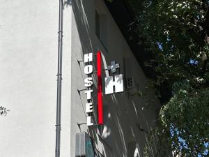 a sign for a hotel on the side of a building at Hostel H in Rivne