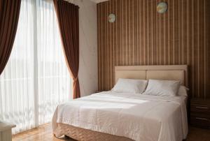 Ένα ή περισσότερα κρεβάτια σε δωμάτιο στο Villa with view rooftop in Nusa Dua