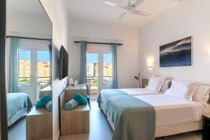 Postel nebo postele na pokoji v ubytování Hotel Médano
