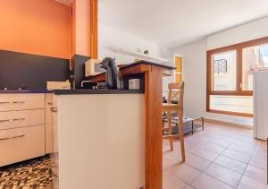a kitchen with a counter top in a room at Apartamentos Wundermar in Torredembarra
