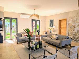 Posezení v ubytování Luxueuse Villa Calypso - Piscine et vue mer