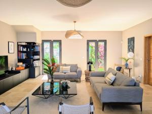 Posezení v ubytování Luxueuse Villa Calypso - Piscine et vue mer