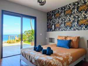 Postel nebo postele na pokoji v ubytování Luxueuse Villa Calypso - Piscine et vue mer