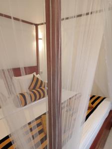 Postel nebo postele na pokoji v ubytování Rich Grove Inn