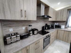 A kitchen or kitchenette at Silver Pearl Apartment