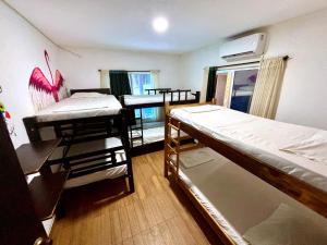 Postel nebo postele na pokoji v ubytování Kimara Tayrona Hostel