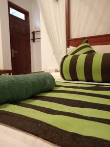 Postel nebo postele na pokoji v ubytování Rich Grove Inn