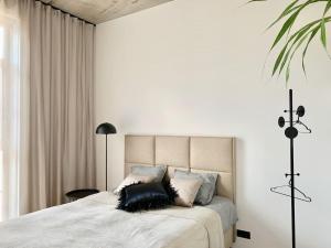 a bedroom with a bed with two pillows on it at Exclusive apartment in Heart of Town in Vanalinn