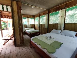 Postel nebo postele na pokoji v ubytování Retama Lodge