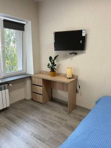 TV a/nebo společenská místnost v ubytování Hostel H