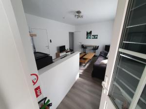 a view of a living room from the hallway of a apartment at Douce Mathilde in Aywaille