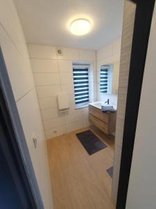 an overhead view of a bathroom with a sink at Douce Mathilde in Aywaille