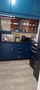 Kuchyň nebo kuchyňský kout v ubytování Modern Apartment in Avenues Harare