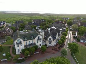 arial view of a residential neighborhood with houses at Hotel Hüttmann in Norddorf